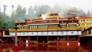 places to visit in Sikkim - Rumtek Monastery with traditional Tibetan architecture and misty forest in Gangtok